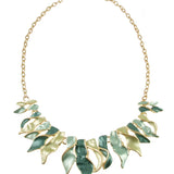 Origin Matte Gold/Green-Aqua Tone Twist Necklace set featuring a matte gold twist chain with a central arrangement of leaf-shaped charms in shades of green and aqua.