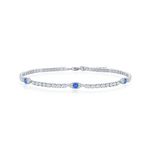 The Classic of New York Sterling Silver/CZ Evil Eye Tennis Bracelet features clear round gemstones with three blue accents, displayed on a white background.