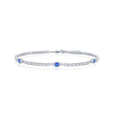 The Classic of New York Sterling Silver/CZ Evil Eye Tennis Bracelet features clear round gemstones with three blue accents, displayed on a white background.
