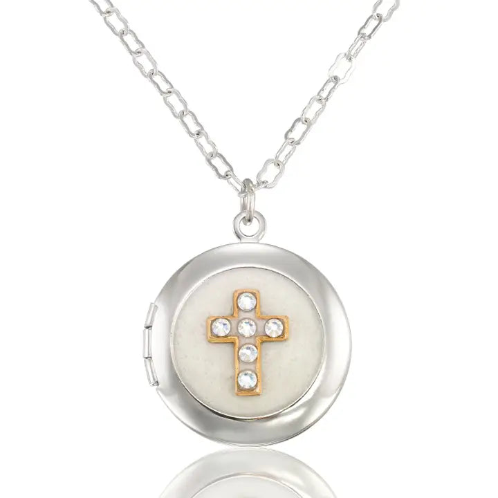 The Faithful White Shimmering Crystal Cross Locket Necklace by Anne Koplik Designs, Inc. features a cross locket with gold and rhinestone accents on a silver chain.