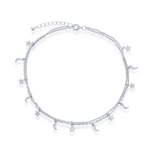The Classic of New York Sterling Silver Moon & Star Double Strand Anklet features delicate star and crescent moon charms with an adjustable clasp, making it a charming accessory for any occasion.