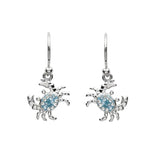 The Shanore Swarovski Crystals Blue Crab Drop Earrings from Ocean Jewelry feature crab-shaped designs with blue crystals, hypoallergenic materials, and comfortable hook fastenings for bold style and all-day wear.