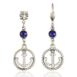 The Anne Koplik Designs ER: Silver & Crystal Nautical Anchor Dangle earrings feature clear and blue crystals with anchor-shaped charms—perfect seaside jewelry for any ocean lover.
