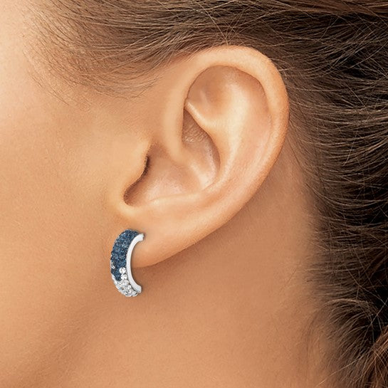 A close-up of a woman’s ear wearing Presco/Quality Gold Crystal Half Loop Earrings, featuring a sparkly textured sterling silver design that transitions in gradient from dark blue at the top to silver at the bottom.