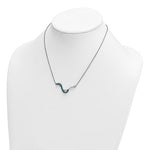 The Presco/Quality Gold Crystal Blue Wave Inlay Necklace features a delicate sterling silver design with a small blue wave pendant, shown on a white mannequin bust.