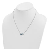 The Presco/Quality Gold Crystal Infinity Necklace features a small blue infinity symbol pendant on a silver chain, elegantly displayed on a white jewelry bust.