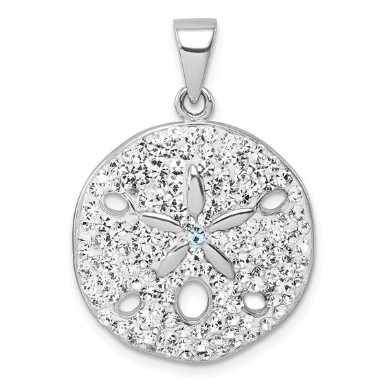 The Presco/Quality Gold Crystal White Sand Dollar Pendant features sparkling white stones, a central blue gem, star details, and cut-out ovals in sterling silver, finished with a bail for easy necklace attachment.