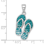 The Presco/Quality Gold Crystal Double Flip Flop Pendant, crafted in sterling silver and embellished with blue and teal crystals, is shown against an inch ruler to display its size.