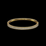 The Be-Je Designs Gold Pave Hinge Bangle Bracelet features three rows of sparkling diamonds in 14kt gold, offering everyday luxury and understated glamour, beautifully presented against a striking black background.