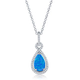 The Classic of New York Caribbean Opal 4 Prong Teardrop & CZ Border Necklace features a blue opal teardrop pendant with cubic zirconia accents on a delicate chain—a striking piece among Caribbean opal necklaces.