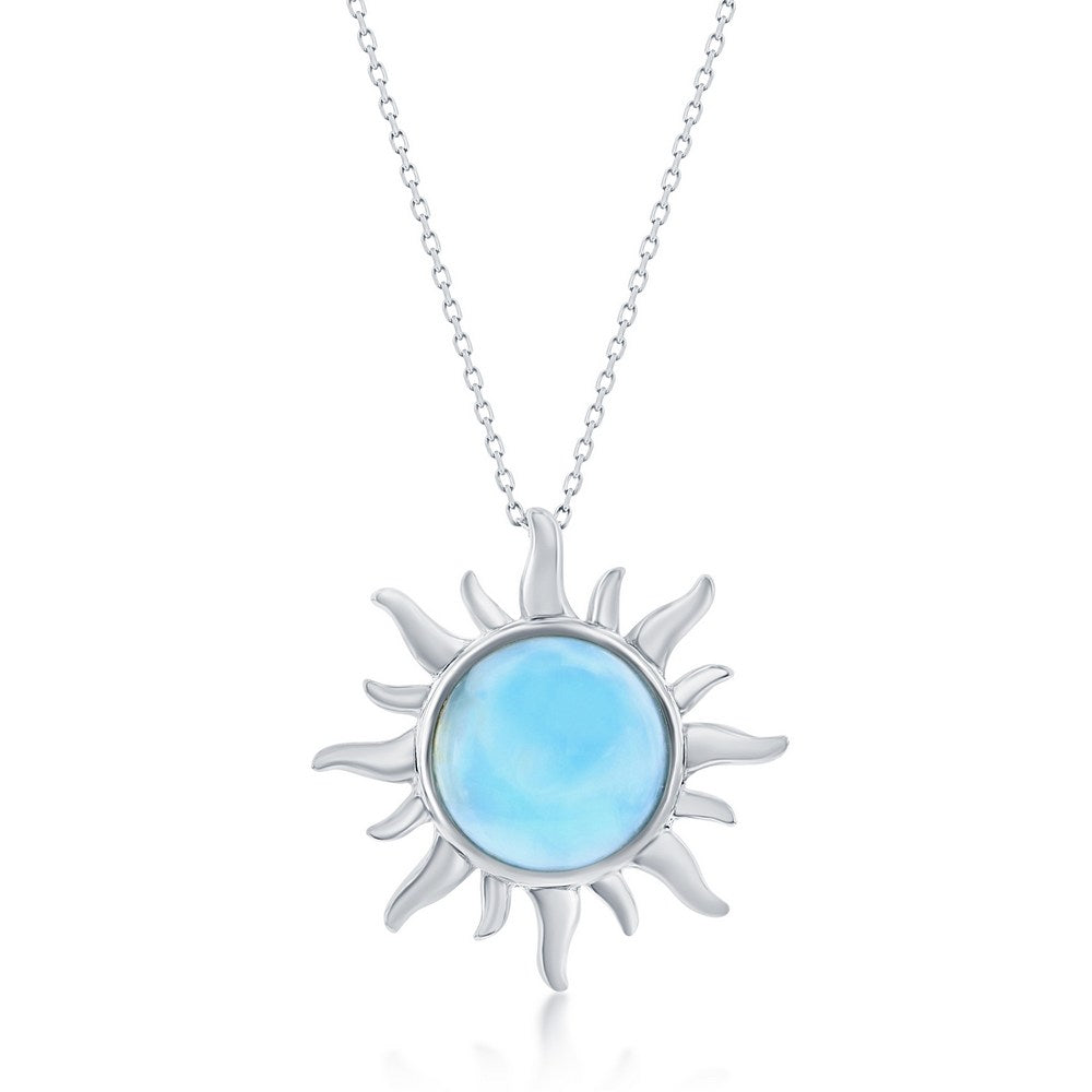 The Classic of New York Larimar Inset Sun Necklace (w/Chain) features a sterling silver sun-shaped pendant with wavy rays and a round, light blue Larimar gemstone at the center.