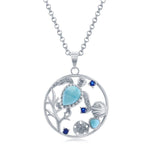 The Classic of New York Larimar Turtle, Seashell, Sand Dollar Necklace features a circular sterling silver pendant with a turtle set in blue stones and ocean-inspired accents, including a shell and sand dollar design.