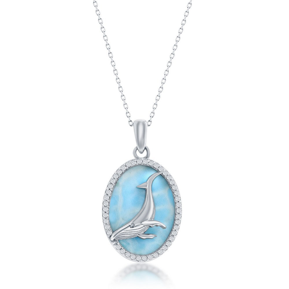 The Classic of New York Larimar w/Center Whale & CZ Outline Necklace features an oval pendant with a light blue larimar center, accented by clear CZ stones and showcasing a silver whale and calf, all on a rhodium-plated chain.
