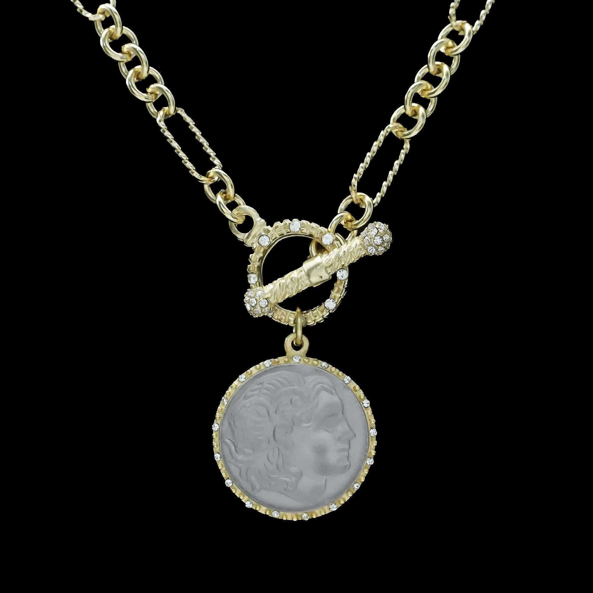 The Be-Je Designs Gold Paperclip with Round Cats Eye Cameo Necklace features a 14kt gold chain, decorative toggle clasp, and a round cat's eye cameo pendant accented with sparkling cubic zirconia on a black background.
