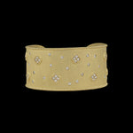 The Be-Je Designs Gold w/Tiny Pave Flowers & CZS Cuff Bracelet features a matte gold finish with scattered CZ stones and pave floral clusters—an elegant, everyday luxury accessory.