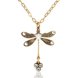 The Anne Koplik Designs, Inc. Single Gold Tone Dragonfly w Triple Crystal Drop Necklace features a gold chain and ornate dragonfly pendant with delicate wings and three clear crystals at the tail.