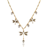 The Dragonfly w/Triple Crystal Drop Collar Necklace by Anne Koplik Designs, Inc. features a vintage-inspired design with dragonfly and triple crystal drops arranged on a delicate chain for an antique-style jewelry look.