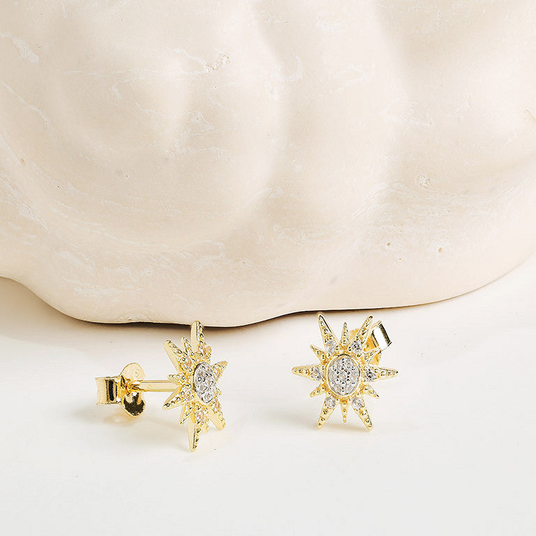 The Shanore Gold Vermeil & White Sapphire Sun Post Earrings are shown against a light, textured background.