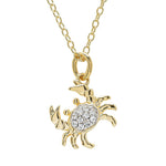 The Shanore Gold Vermeil & White Sapphire Crab Mini Necklace showcases a crab-shaped pendant with sparkling white sapphires on a delicate chain.
