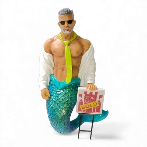 The December Diamonds Open House Ornament features a muscular merman with gray hair, sunglasses, open white shirt, neon green tie, and blue-scaled tail holding a For Sale Sold sign—a unique addition to your holiday or Merman decor.