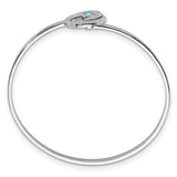 The Presco/Quality Gold Crystal Wave Bangle Bracelet is a thin sterling silver piece with a small oval clasp and a single light blue gemstone, offering a simple yet elegant, timeless jewelry design.