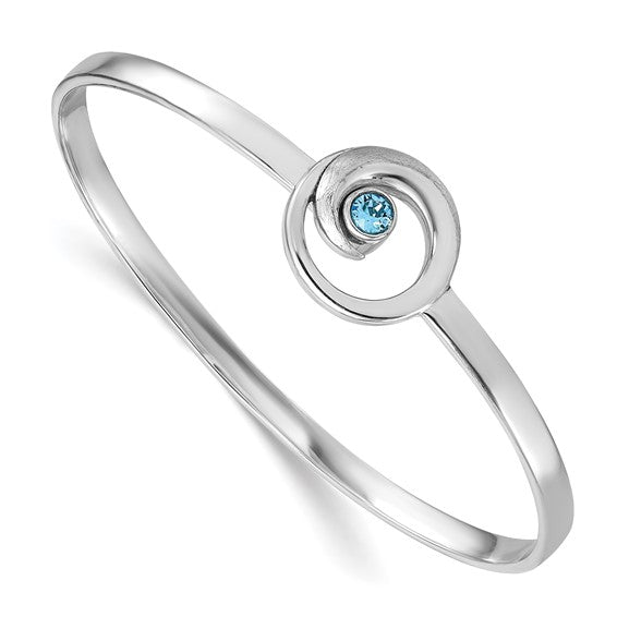 The Crystal Wave Bangle Bracelet by Presco/Quality Gold showcases a sterling silver band with a central circular swirl design set with a small blue gemstone—an elegant accessory for any occasion.