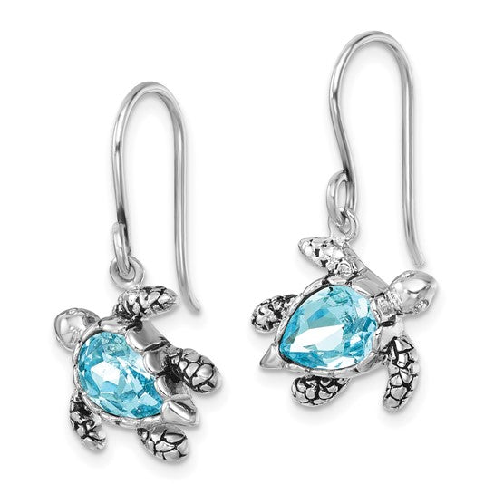 Crystal Medium Blue Turtle Earrings by Presco/Quality Gold feature turtle-shaped sterling silver with blue, heart-shaped gemstones and hook-style backs for easy wear.