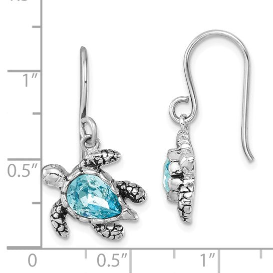 The Presco/Quality Gold Crystal Medium Blue Turtle Earrings feature detailed silver bodies, blue gemstone shells, hook fastenings, and are shown next to a ruler for scale.