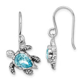 The Presco/Quality Gold Crystal Medium Blue Turtle Earrings feature textured sterling silver and a central blue teardrop gemstone. Shown are front and side views of this elegant jewelry pair.