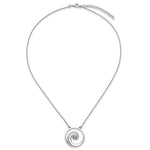 The Crystal Wave Aqua Crystal Pendant by Presco/Quality Gold features a thin silver chain with concentric sterling silver rings and a central aqua crystal accent.