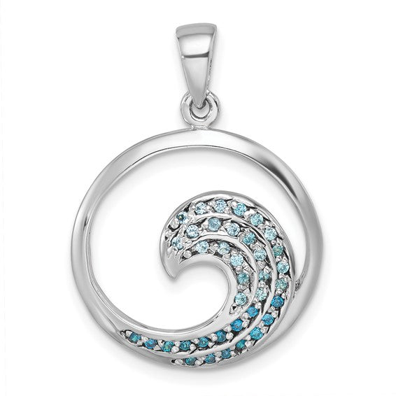 The Presco/Quality Gold Crystal Medium Blue Wave Pendant features a sterling silver wave inside a circular frame with light and dark blue gemstones—an elegant, ocean-inspired accessory.