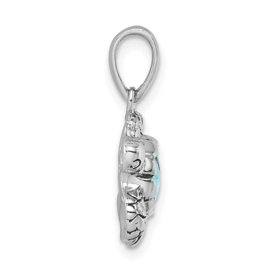 Side view of the Crystal Medium Aqua Turtle Pendant by Presco/Quality Gold, crafted in sterling silver with a large oval aqua crystal center, a simple rounded bail, and decorative detailing around the gemstone.