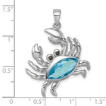 The Presco/Quality Gold Crystal Crab Pendant showcases a blue gem body and black gem eyes in sterling silver, displayed against a grid with measurements up to 1.5 inches for scale—a unique crystal jewelry piece.