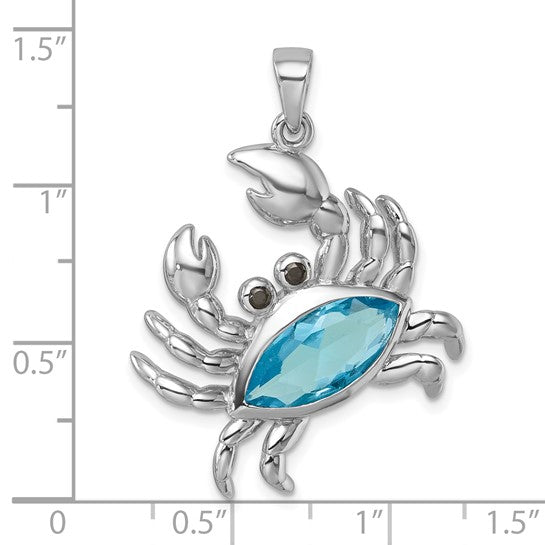 The Presco/Quality Gold Crystal Crab Pendant showcases a blue gem body and black gem eyes in sterling silver, displayed against a grid with measurements up to 1.5 inches for scale—a unique crystal jewelry piece.