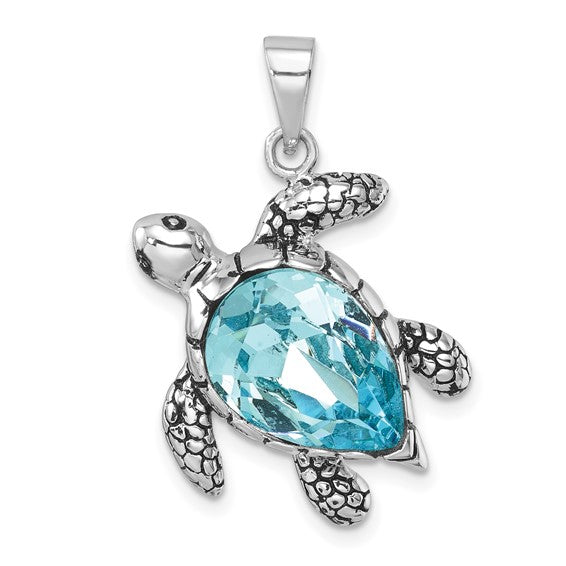 The Presco/Quality Gold Crystal Medium Turtle Pendant features a faceted blue gemstone shell with textured sterling silver flippers and head, and comes on a small metal loop for easy attachment to your favorite chain.