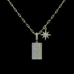 The Be-Je Designs Gold Pave CZ Starburst & Cross Necklace features sparkling pendants—a dazzling starburst and a shimmering cross—on an adjustable 14kt gold chain for timeless elegance.