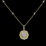 The Be-Je Designs Gold Clear Pave CZ Heart Charm Necklace features a square pendant with a raised, diamond-lined heart on brushed 14kt gold. This adjustable necklace is elegantly shown against a black background.