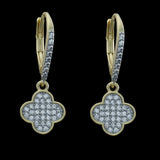 Be-Je Designs Gold/Silver CZ Pave Clover Dangle Leverback Earrings feature four-leaf clover pendants with sparkling cubic zirconia and gemstone-accented hooks, set against a sleek black background.