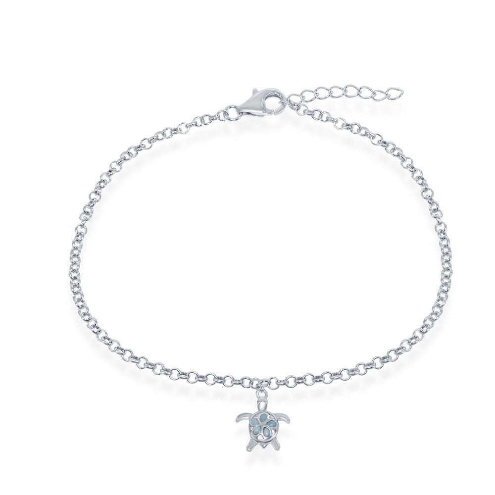 The Classic of New York Larimar Turtle Dangle Anklet features a sterling silver chain, blue Caribbean gemstone accents, a turtle charm, and is secured with a lobster clasp plus adjustable extender.