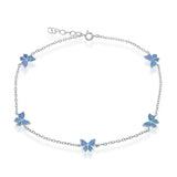 The Classic of New York Caribbean Opal Inlay Butterfly Anklet features five blue butterfly charms on a sterling silver chain with an adjustable clasp, inspired by Caribbean opal anklets—ideal for your beach jewelry collection.