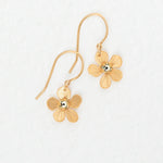 The Plumeria Drop Gold Earrings by Holly Yashi feature textured, flower-shaped petals with a shiny center—feminine jewelry perfect for garden parties. Displayed on a white background.