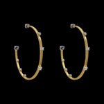 Be-Je Designs Gold Filled Small Hoop w/ CZ Prongs: elegant gold-filled hoops adorned with small clear cubic zirconia, showcased on a solid black background.