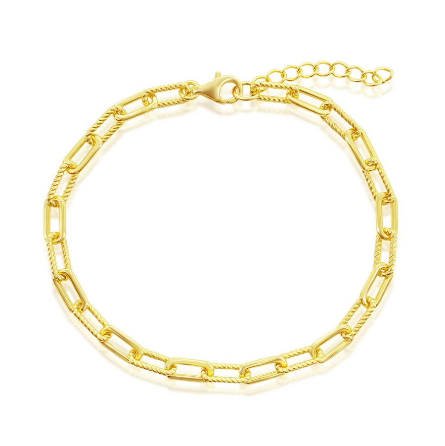 The Classic of New York Gold Plated Polished & Rope Paperclip Bracelet features rectangular links, a lobster clasp, and an adjustable extension chain. This delicate bracelet boasts a polished, shiny finish for elegant style.