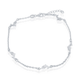 The Classic of New York Sterling Silver Dolphin Anklet features small dolphin charms evenly spaced along a delicate 925 sterling silver chain, beautifully displayed against a white background.