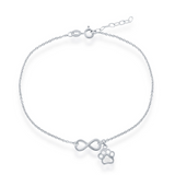 The Sterling Silver Infinity & Paw Print Anklet by Classic of New York features an adjustable chain, lobster clasp, and delicate charms—a central infinity symbol and a small paw print.