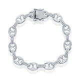 The Classic of New York Sterling Silver Pave CZ Marina Link Bracelet features alternating oval and cylindrical links, some with pave CZ stones, arranged in a circle and finished with a decorative clasp.