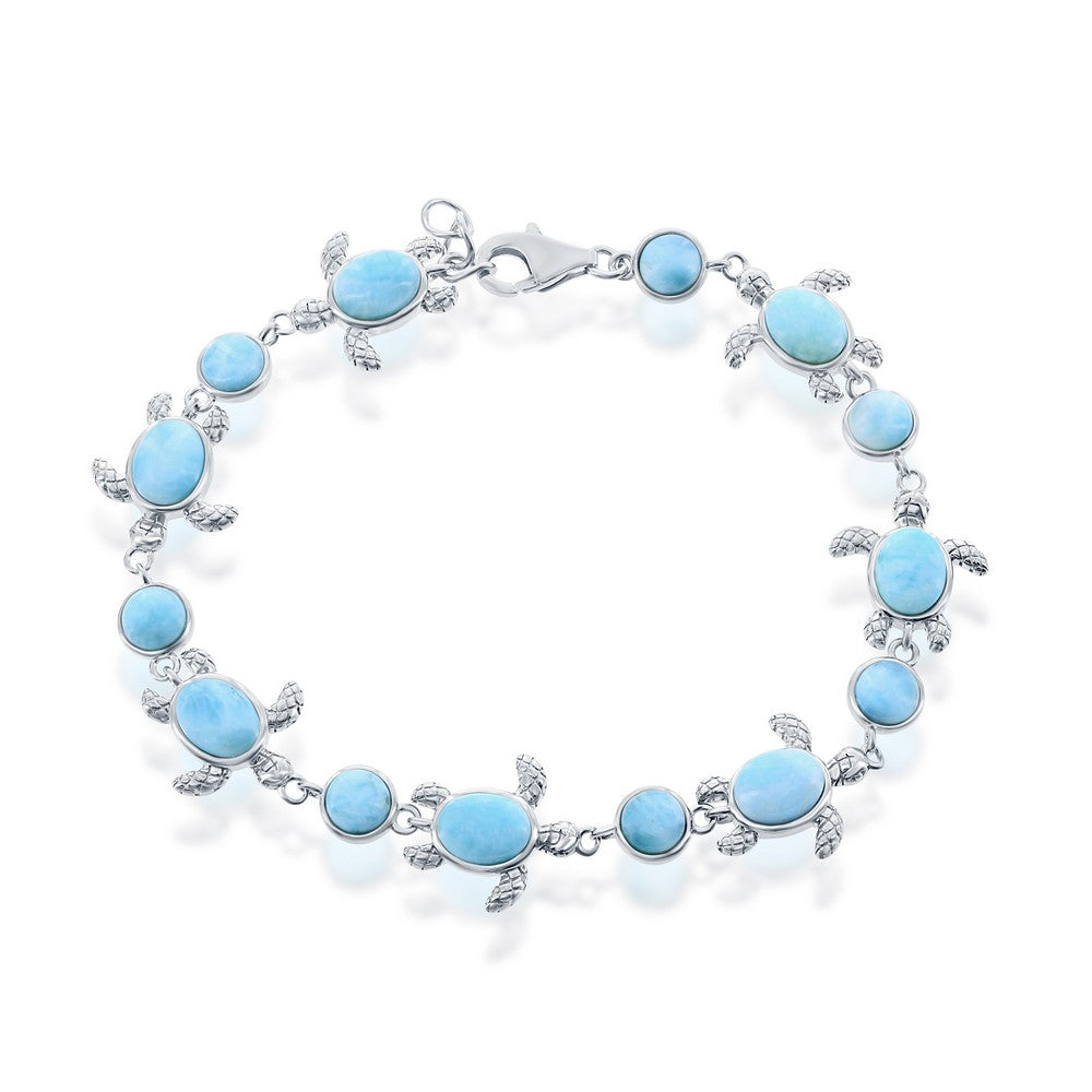 The Classic of New York Larimar Round/Turtle Bracelet features oval and round blue Larimar stones in turtle-shaped sterling silver frames, linked on a delicate chain with a lobster clasp.