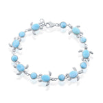 The Classic of New York Larimar Round/Turtle Bracelet features oval and round blue Larimar stones in turtle-shaped sterling silver frames, linked on a delicate chain with a lobster clasp.