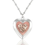 The Anne Koplik Designs, Inc. Pink Pave Heart Shaped Locket Pendant Crystal Necklace features a vintage-inspired heart locket with a sparkling pink crystal center on a delicate silver-plated chain.
