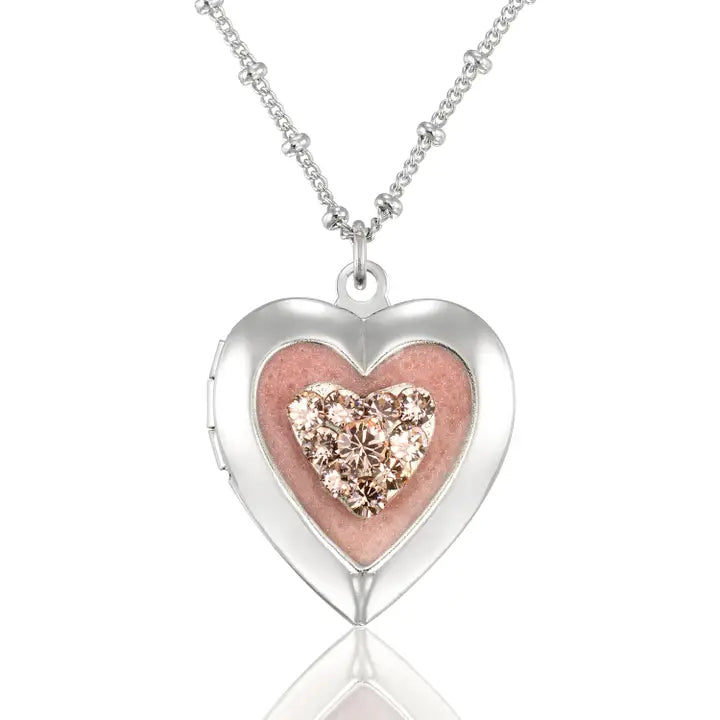 The Anne Koplik Designs, Inc. Pink Pave Heart Shaped Locket Pendant Crystal Necklace features a vintage-inspired heart locket with a sparkling pink crystal center on a delicate silver-plated chain.